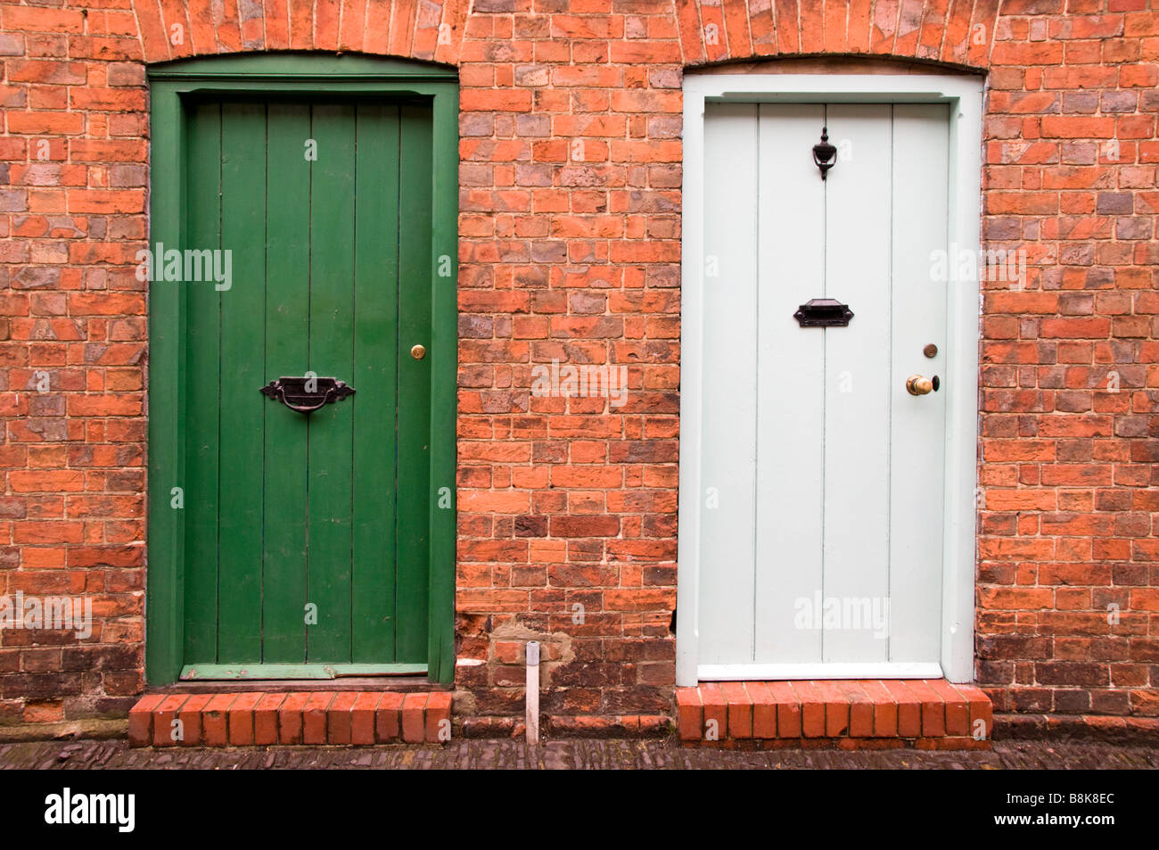 Two doors of cottages adjacent to each other, Farnham, Surrey, UK Stock