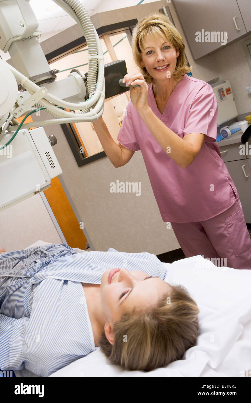 Nurse With Patient Having An X-Ray Stock Photo
