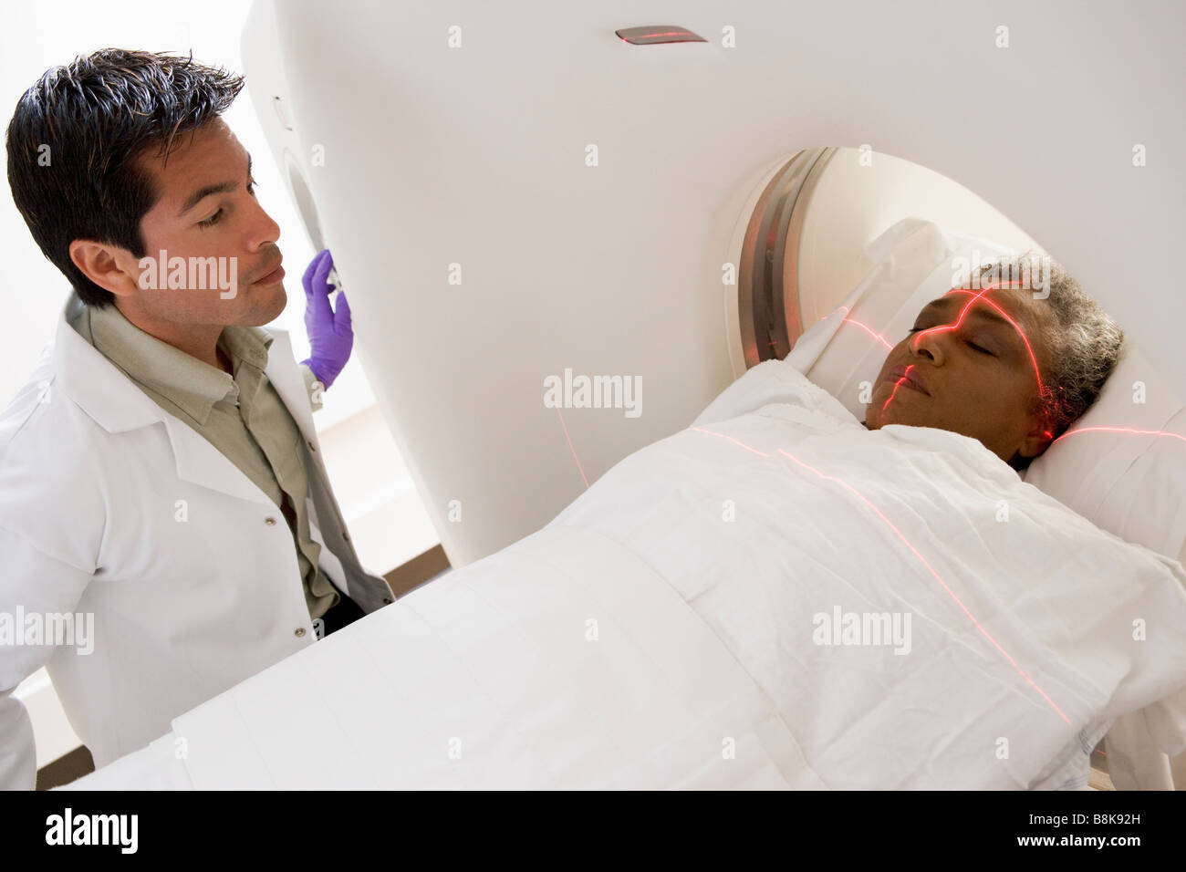 Doctor With Patient Having A Computerized Axial Tomography Cat Scan