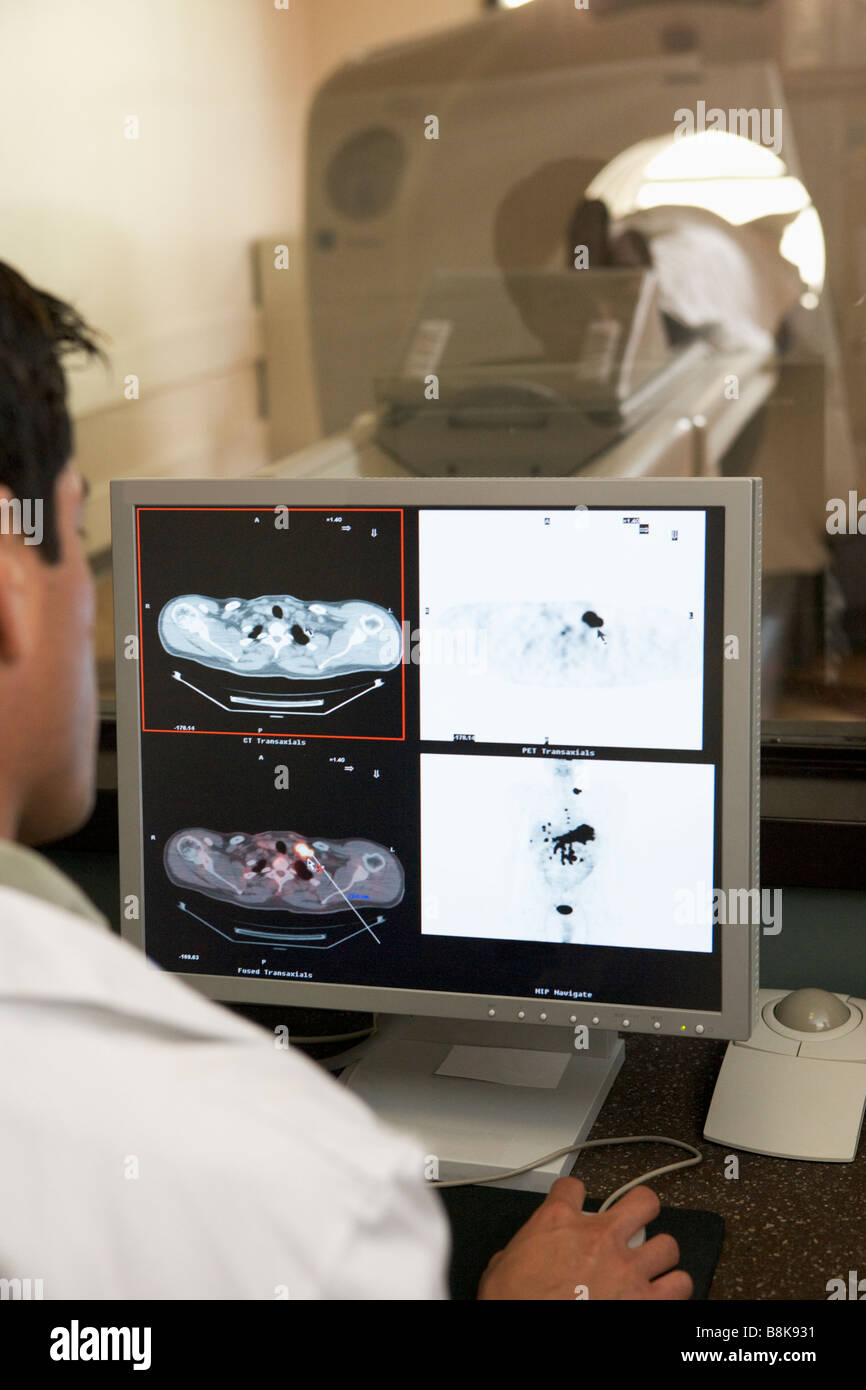 Doctor Monitoring Patient Having Computerized Axial Tomography (CAT ...