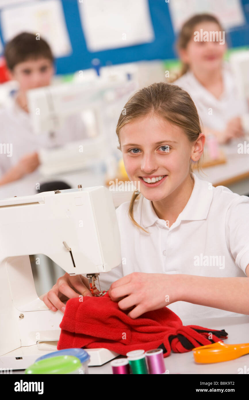 Female student using sewing machine Stock Photo Alamy