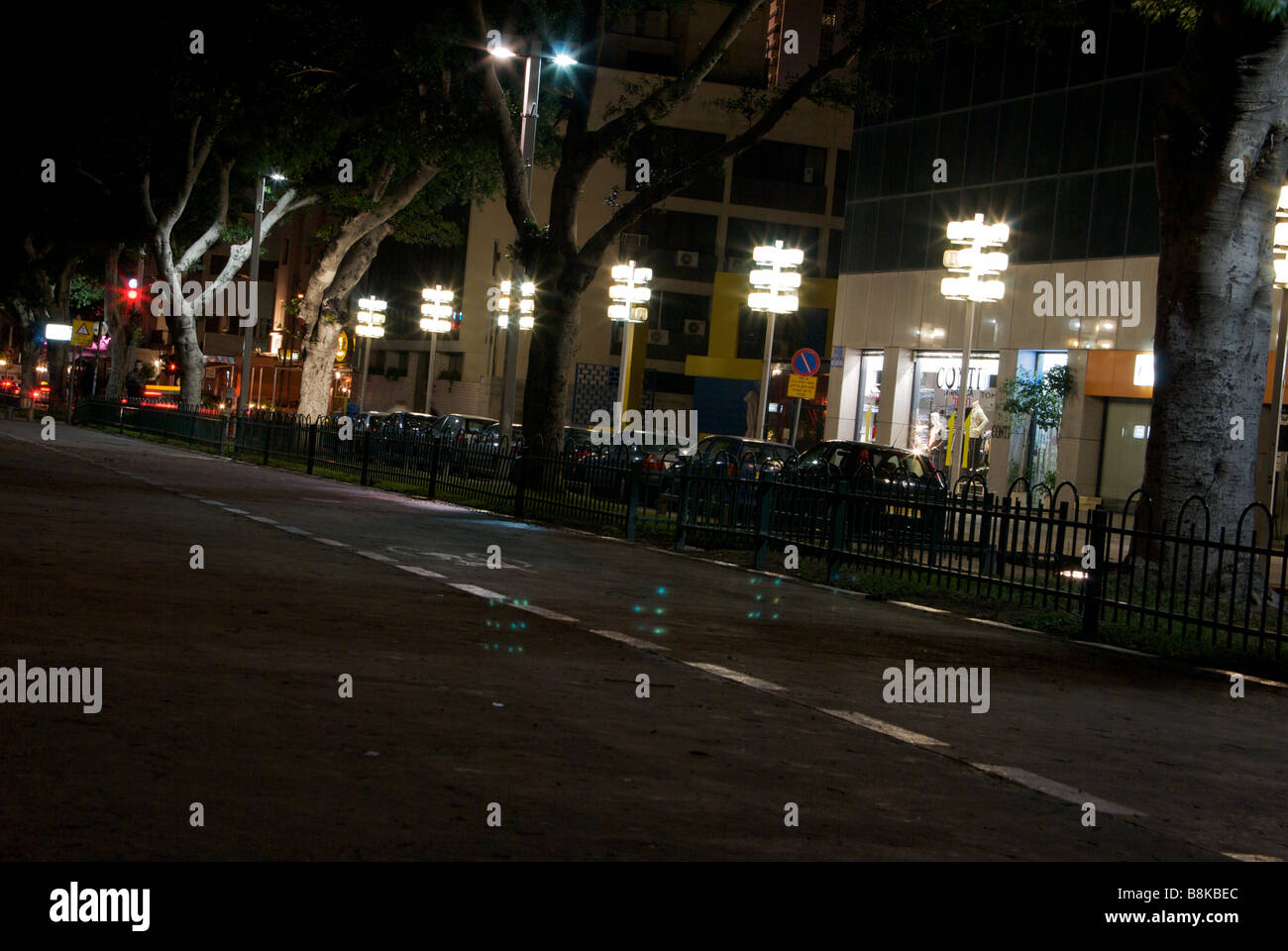 High end shops and cafes line busy vibrant Rothschild Boulevard late at