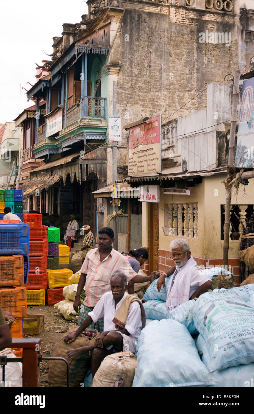 India Tamil Nadu Madurai North Avani Street bazaar men relaxing on