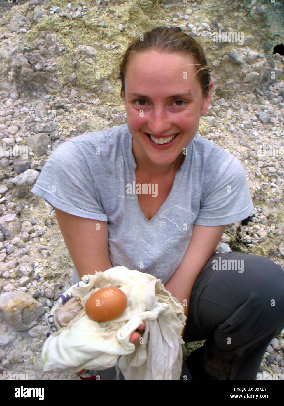 Tourist Boiling Egg in Volcanic Water on the Caribbean Island of Dominica Stock Photo