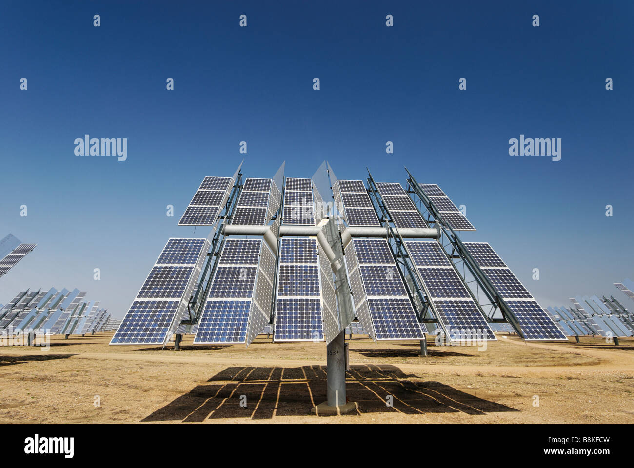 Solúcar power plant photovoltaic PV concentration tracker unit produces clean energy from the sun - Abengoa in Andalucia Spain Stock Photo