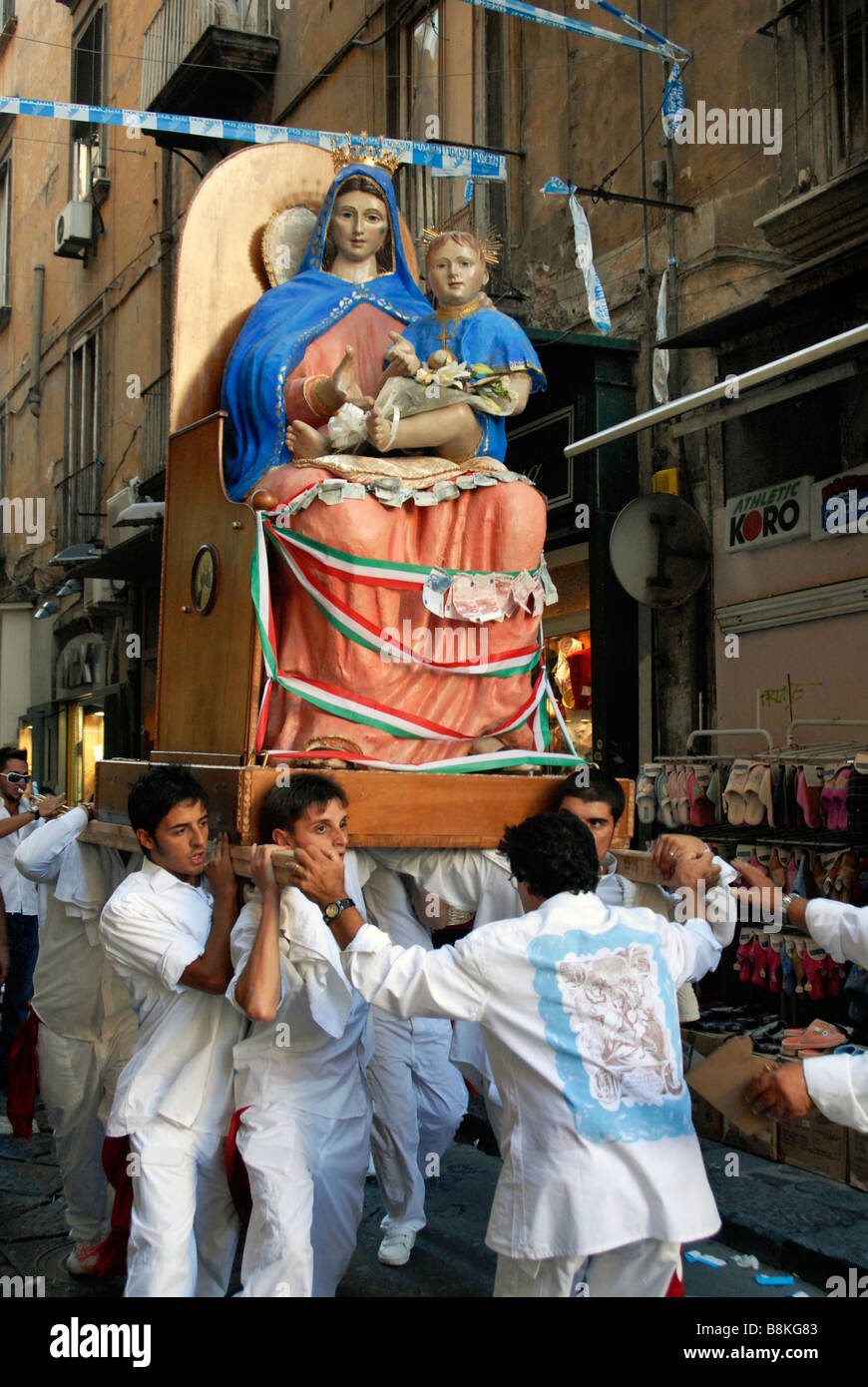 A Virgin Mary statue being carried around the Spagnoli district in