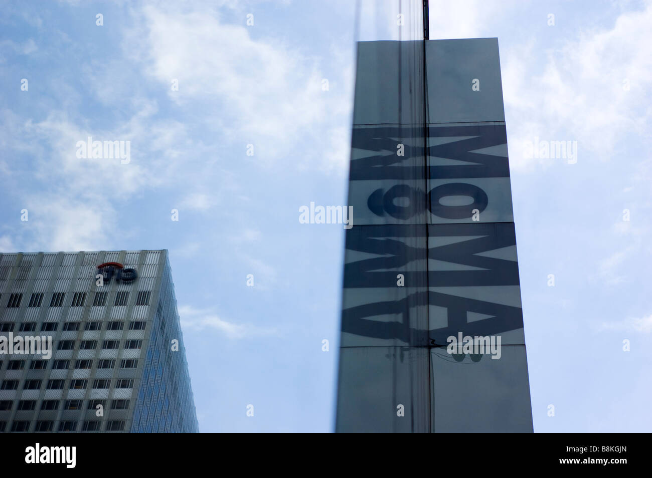Low Angle View of Museum of Modern Art (MOMA) Building with Citibank Logo on Building Reflected in Windows in New York City, USA Stock Photo