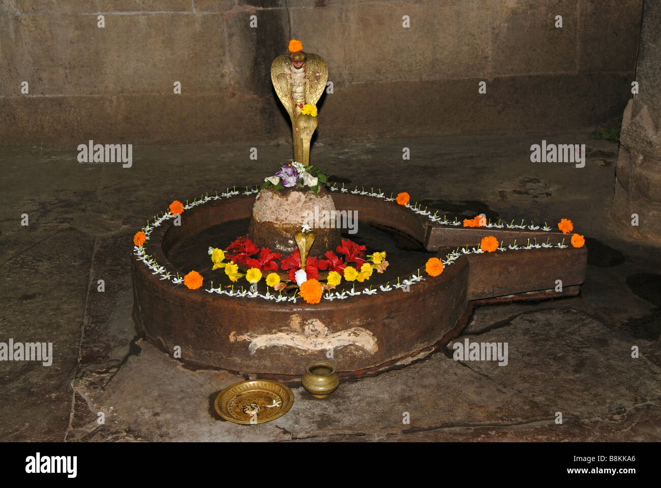 Siddheshwar temple- Shiva-lingam in the main shrine of the temple in worship. Orissa, Bhubaneshwar, India. Stock Photo