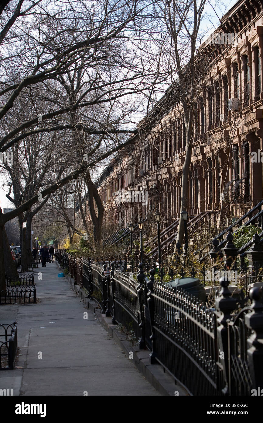 Brooklyn brownstone row houses line a quiet street in the Park Slope