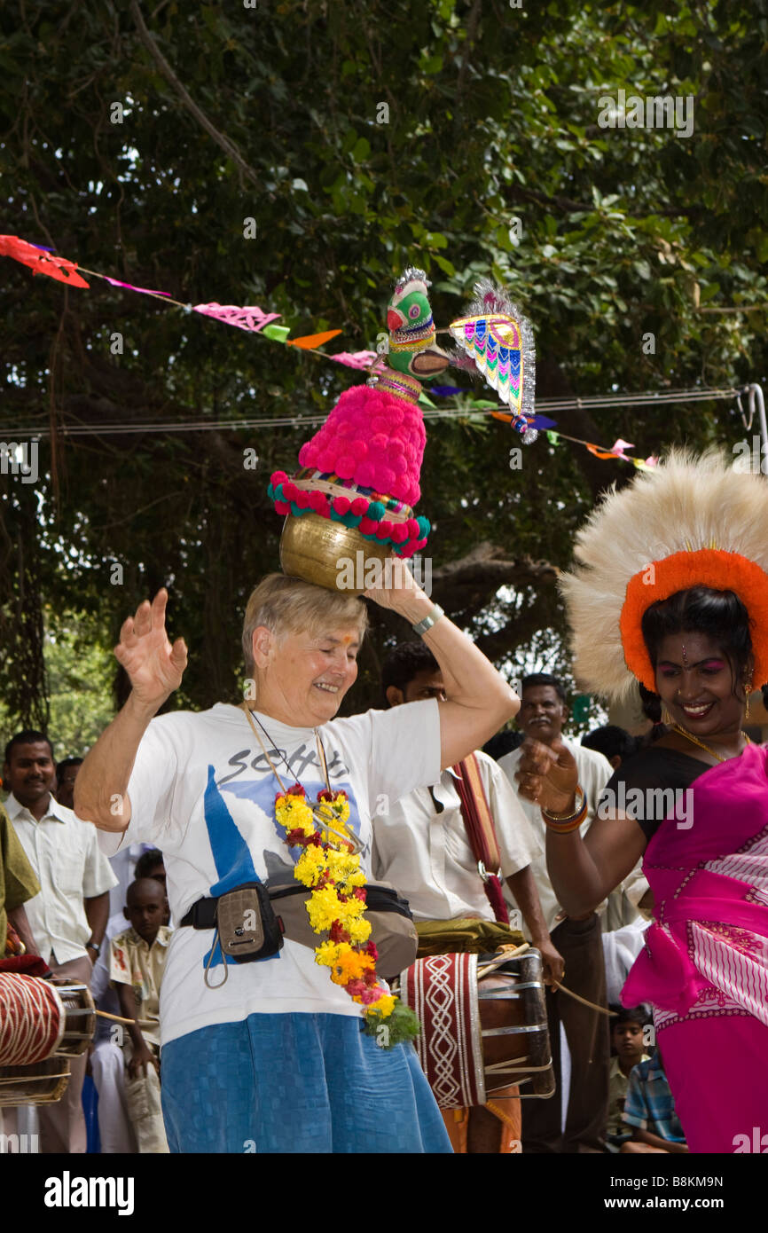 India Tamil Nadu Madurai Tidiyan village pongal celebrations western woman dancing with pot on head Stock Photo