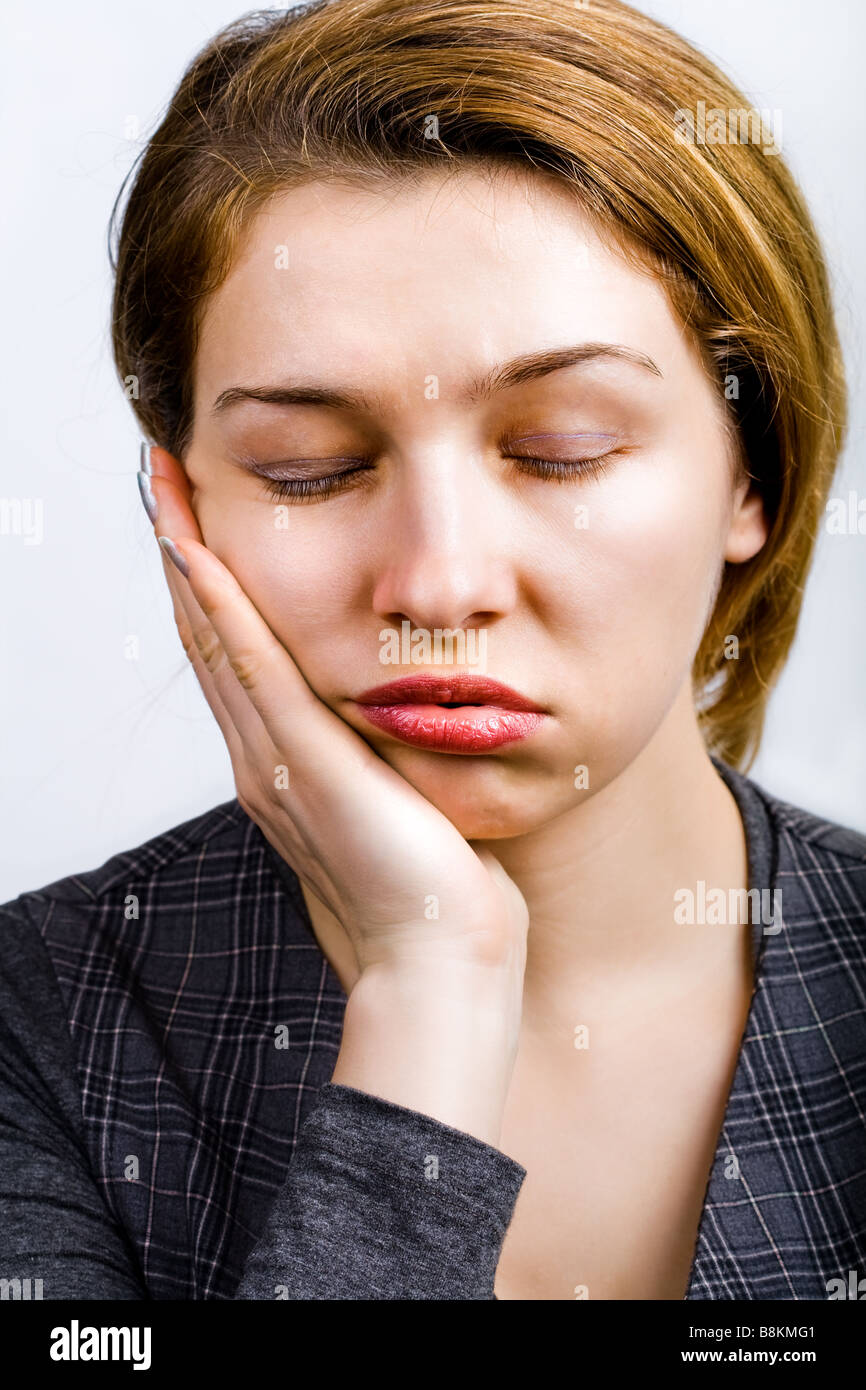 Portrait of sleepy woman looking very bored and tired Stock Photo