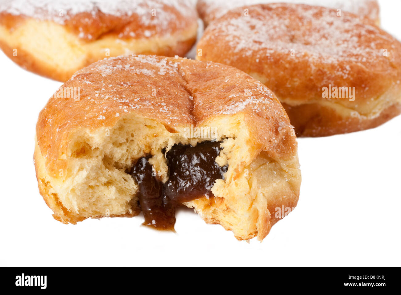 Four sugar topped Paczki with the prune filling Stock Photo Alamy