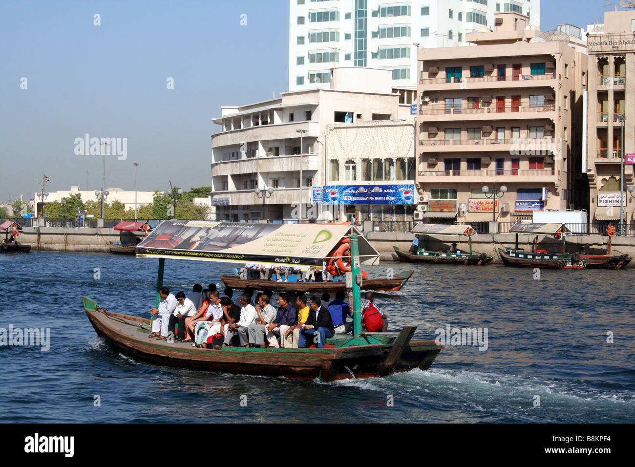 Traditional Abra Ferry Crossing Dubai Creek in Dubai in the UAE Stock Photo