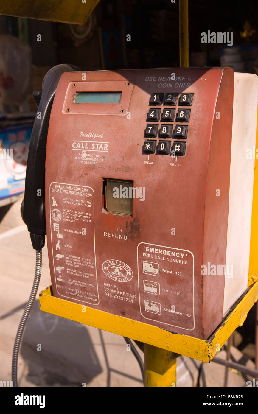 India Tamil Nadu Tiruvannamalai public pay phone outside small market shop Stock Photo