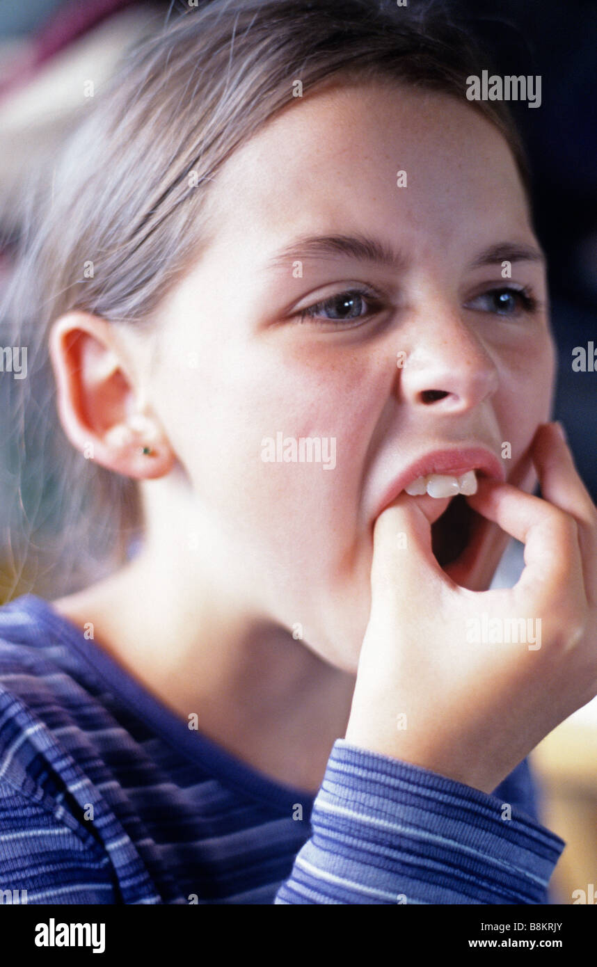 Girl pulling tooth with fingers Stock Photo Alamy