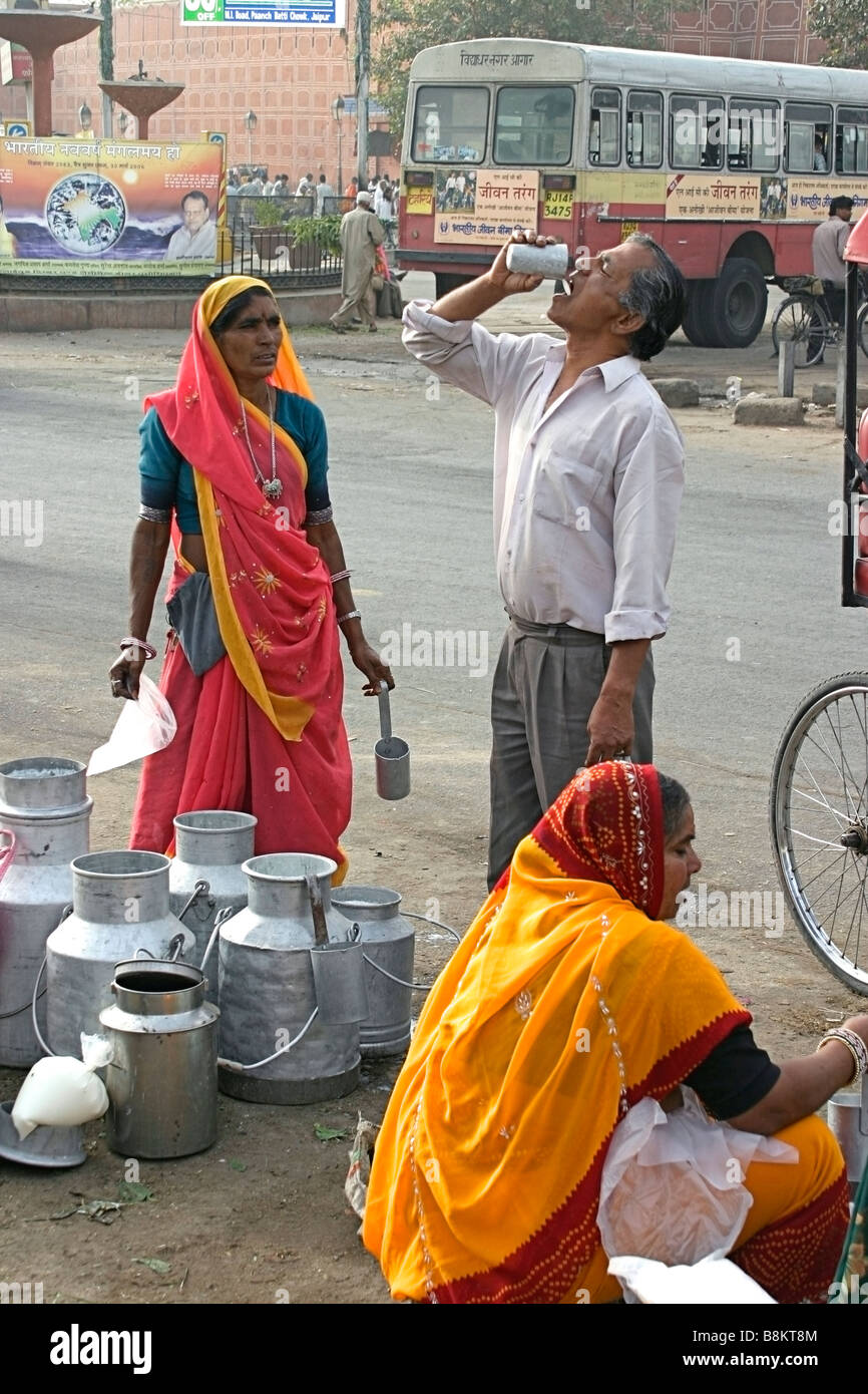 Man drinking milk sold by women at the roadside Jaipur Rajasthan India  Stock Photo - Alamy