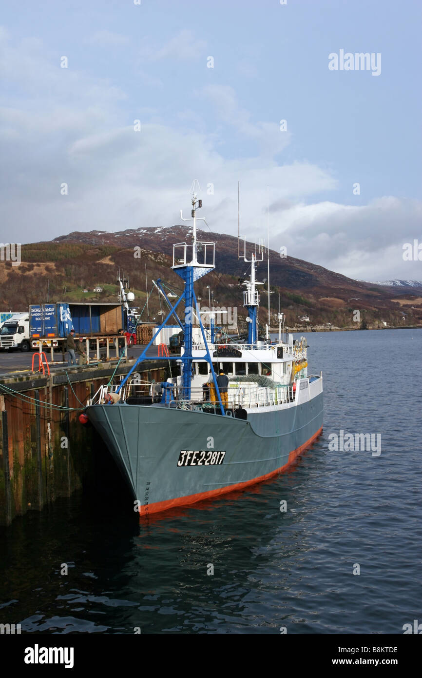 Fishing boat moored in Ullapool Harbour Stock Photo
