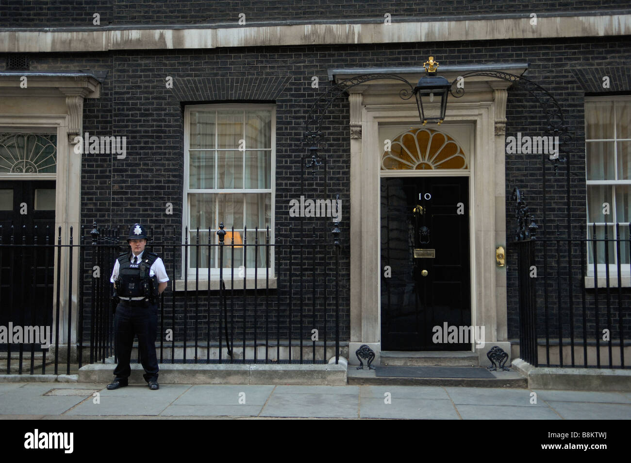 Number ten Downing Street, the home of the British Prime Minister, with a security guard posted outside. Stock Photo