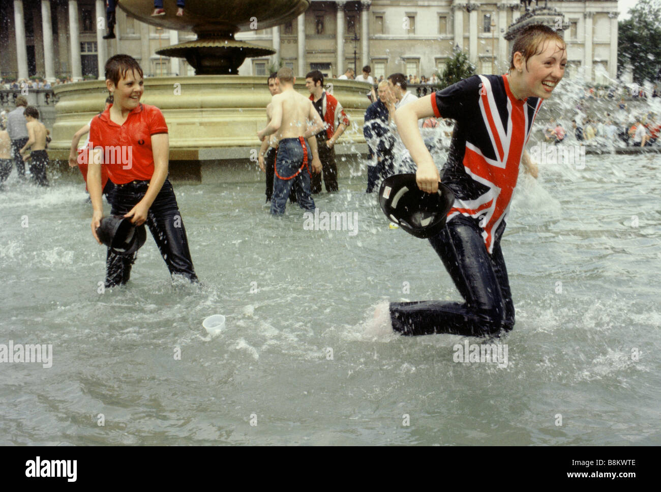 Trafalgar Square London UK Skinheads play in the fountain in Trafalgar Square on the day of the Royal wedding Stock Photo