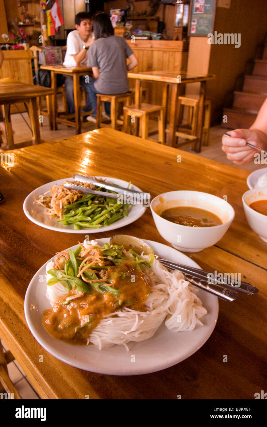 Traditional rice noodles with spicy peanut sauce fresh beans and banana flower Bangkok Thailand Stock Photo