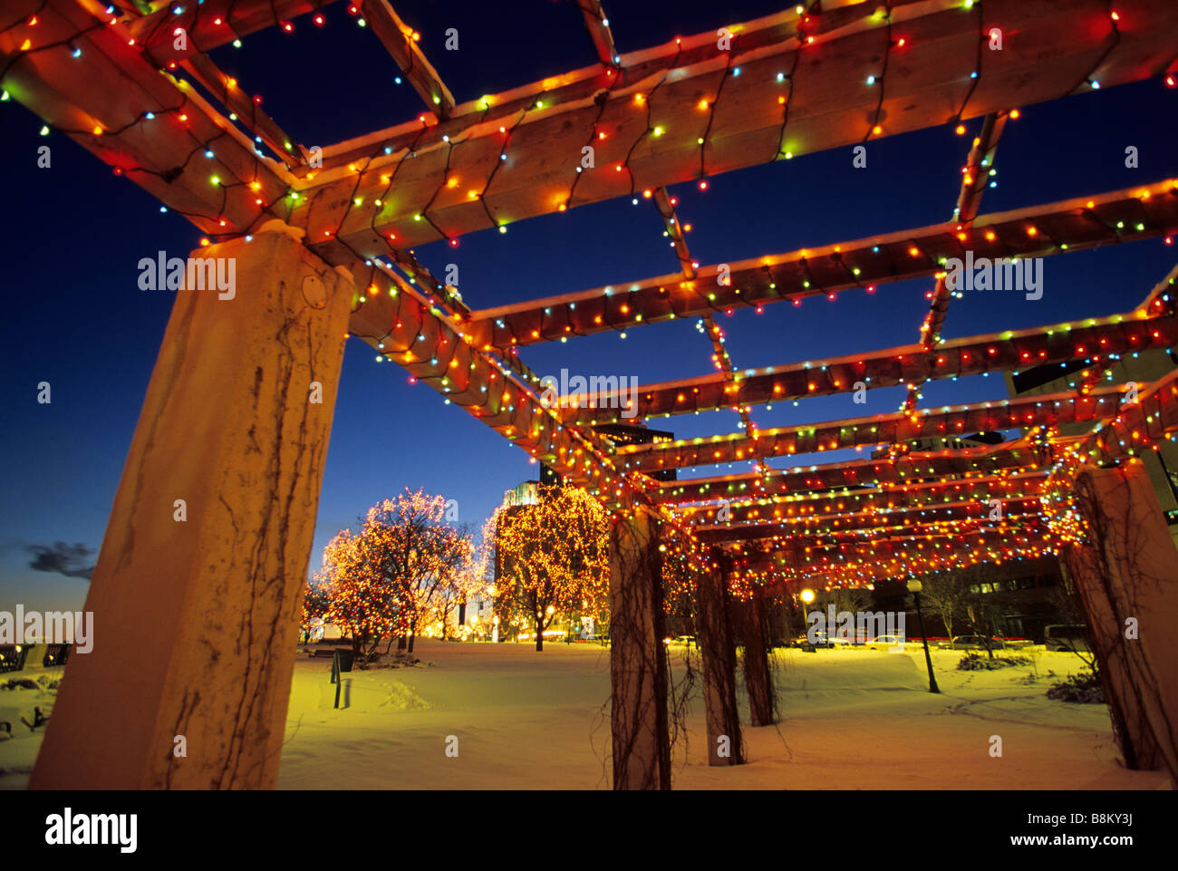 HOLIDAY LIGHTS IN SMALL PARK ALONG THE MISSISSIPPI RIVER, DOWNTOWN ST. PAUL, MINNESOTA. DECEMBER