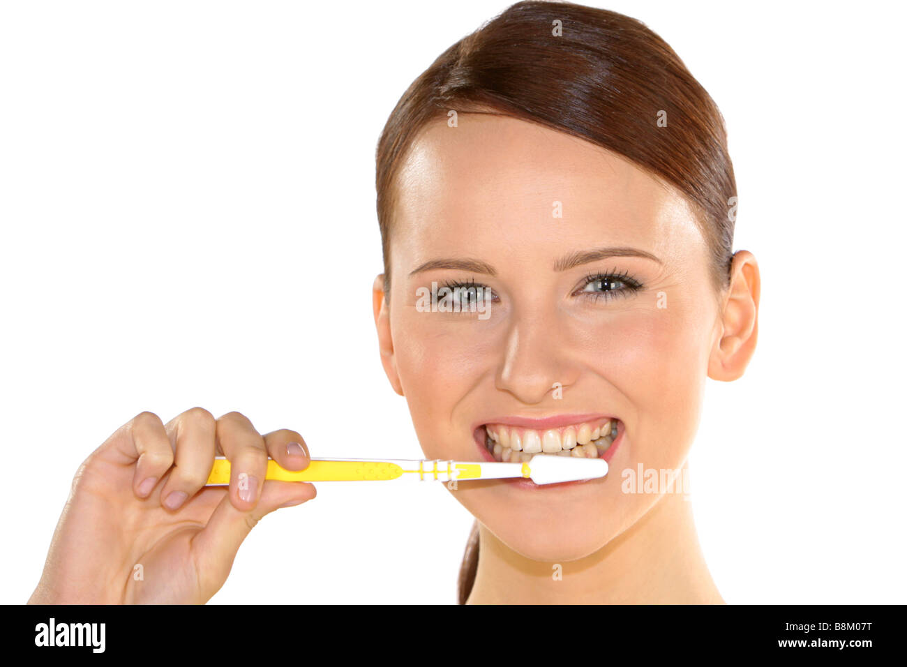 Pretty young woman brushes his teeth with a toothbrush Stock Photo