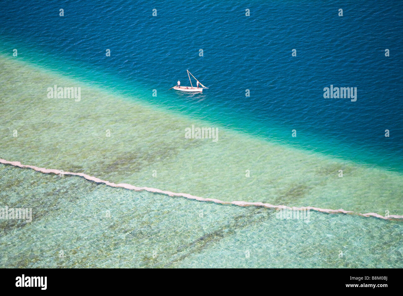 Aerial view of small boat in turquoise waters of Indian ocean Stock ...