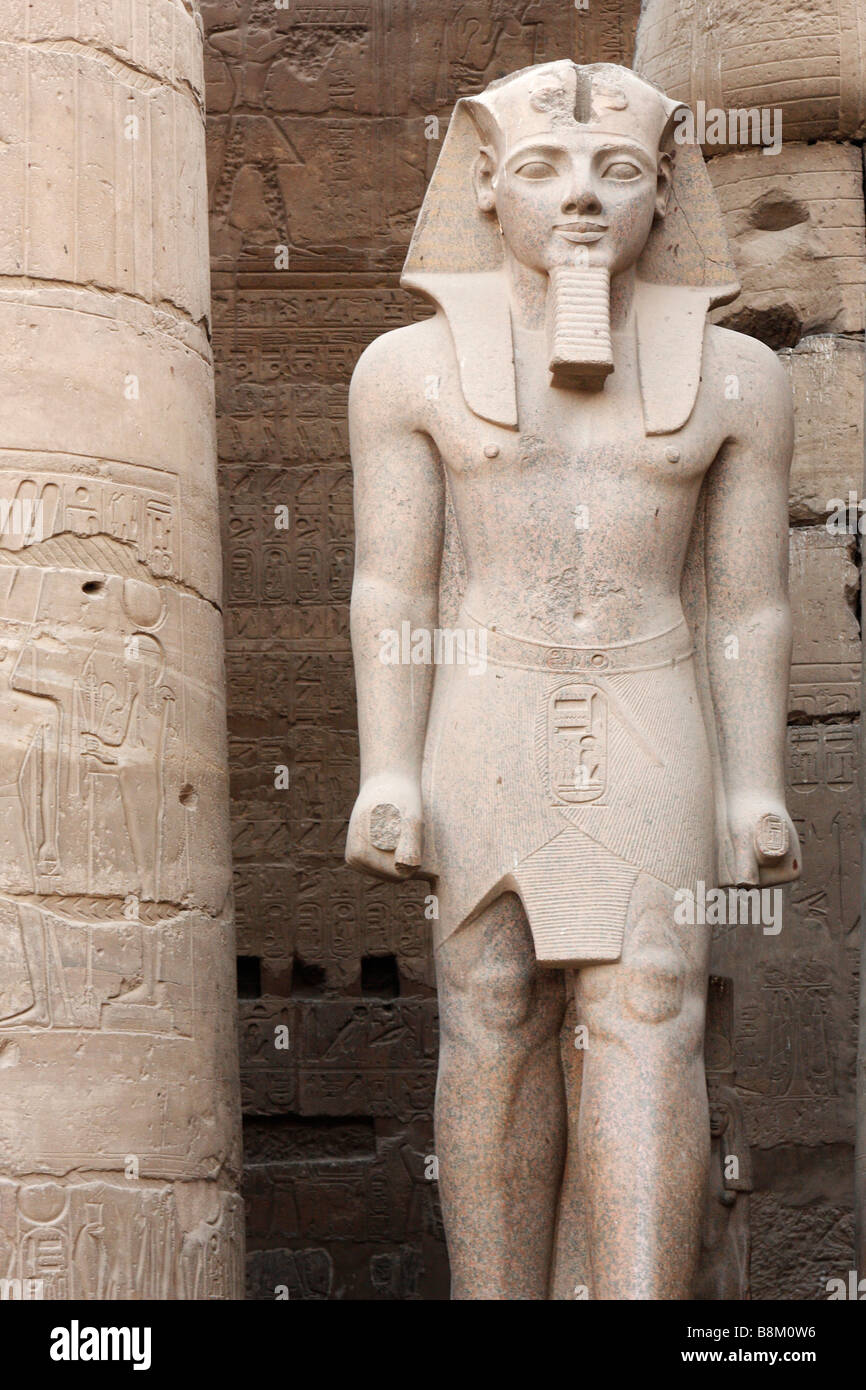 Large stone statue of Pharaoh Ramses II, Great Court, Luxor Temple, Egypt Stock Photo