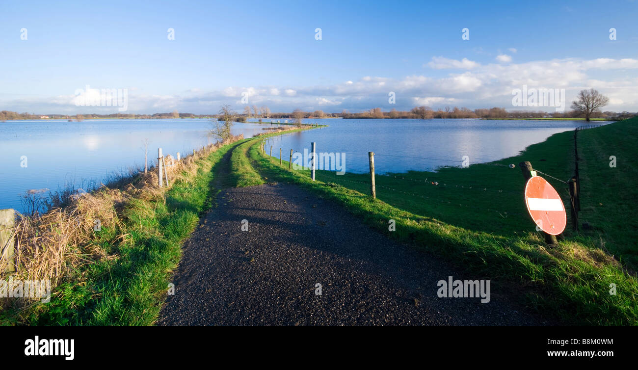 a road into a flooded river IJssel river Netherlands Stock Photo