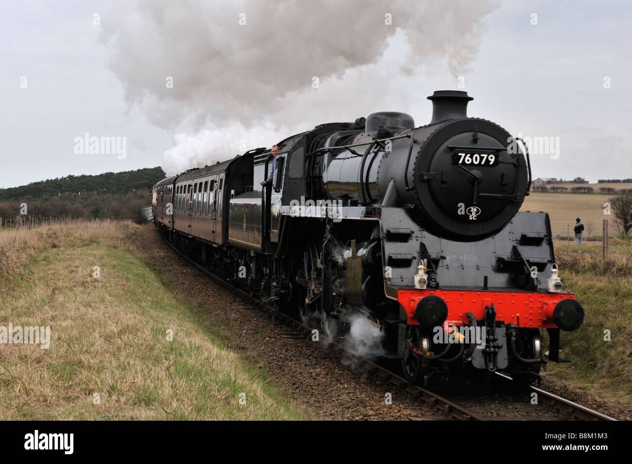 Steam locomotive approaching Weybourne Stock Photo