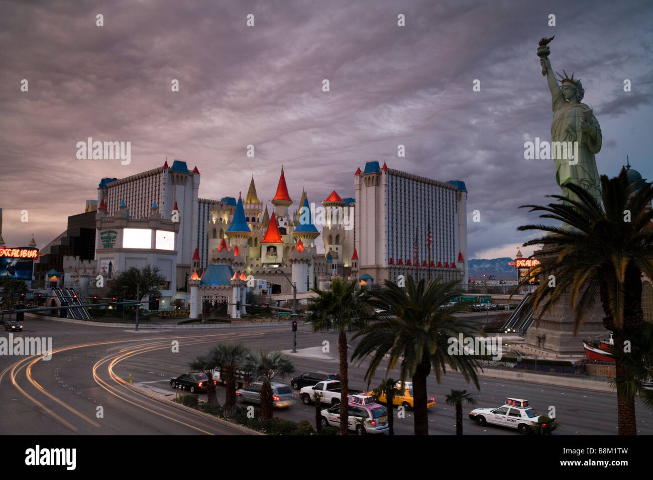 Dark clouds over the Statue Of Liberty and the Excalibur Hotel and casino on the Las Vegas strip, Nevada, USA Stock Photo