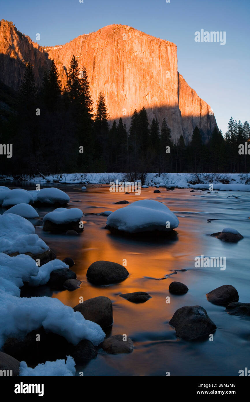 El Capitan and snowy rocks in the Merced river at sunset in Yosemite National Park, USA Stock Photo