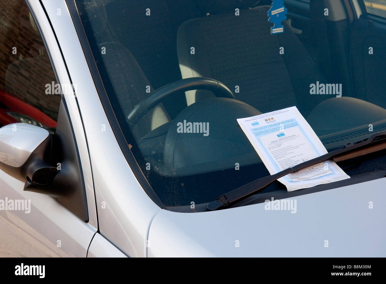 A parking penalty charge notice attached to a car Eastbourne East Sussex Stock Photo