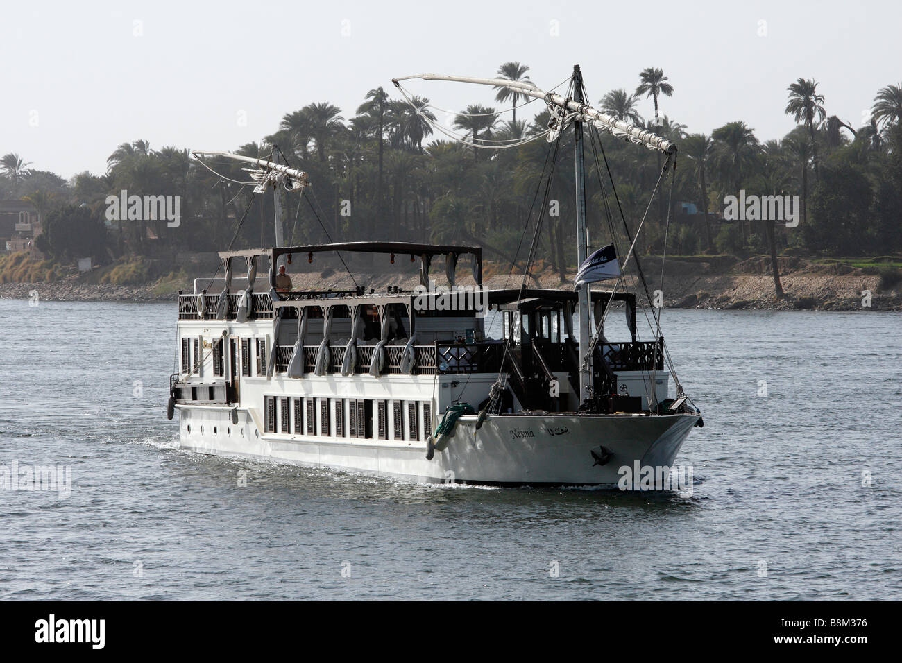 A cruise boat sailing down the Nile River in Egypt Stock Photo - Alamy