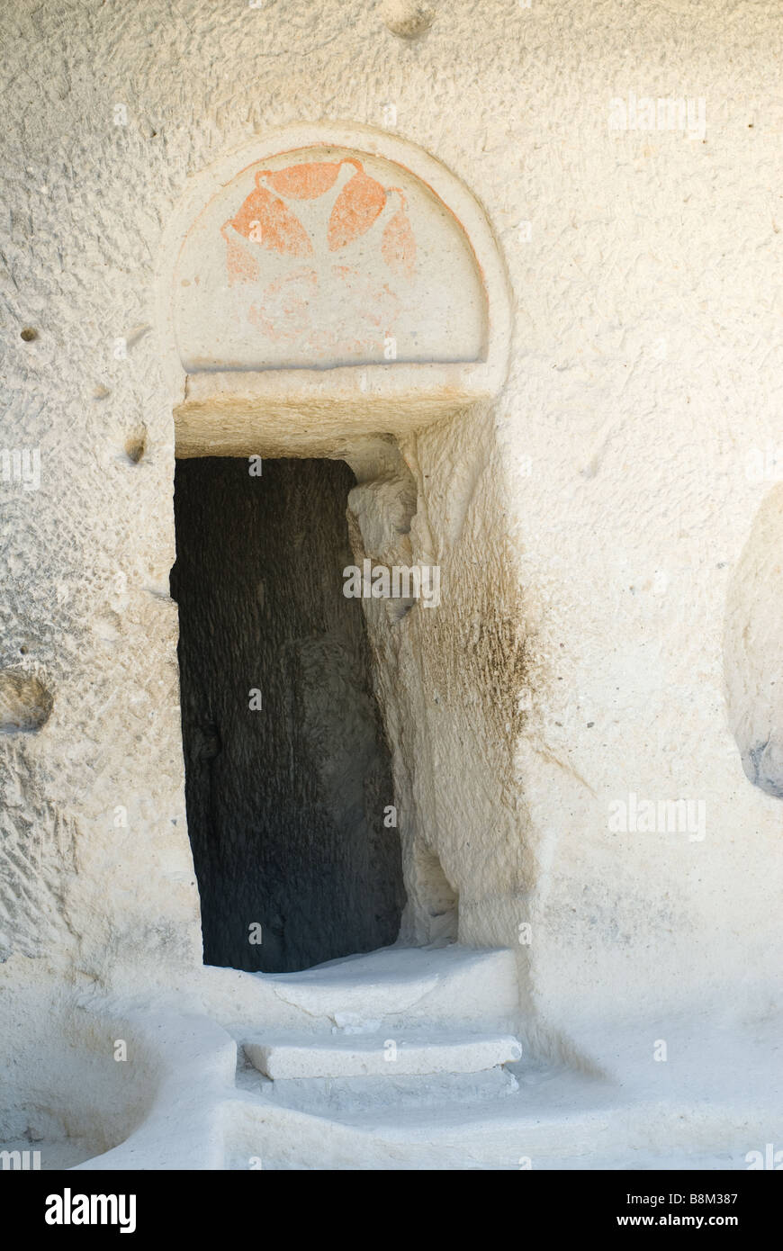 Cappadocia, Göreme open air museum, ancient Christian cave, doorway, depiction of a red cross, Turkey Stock Photo