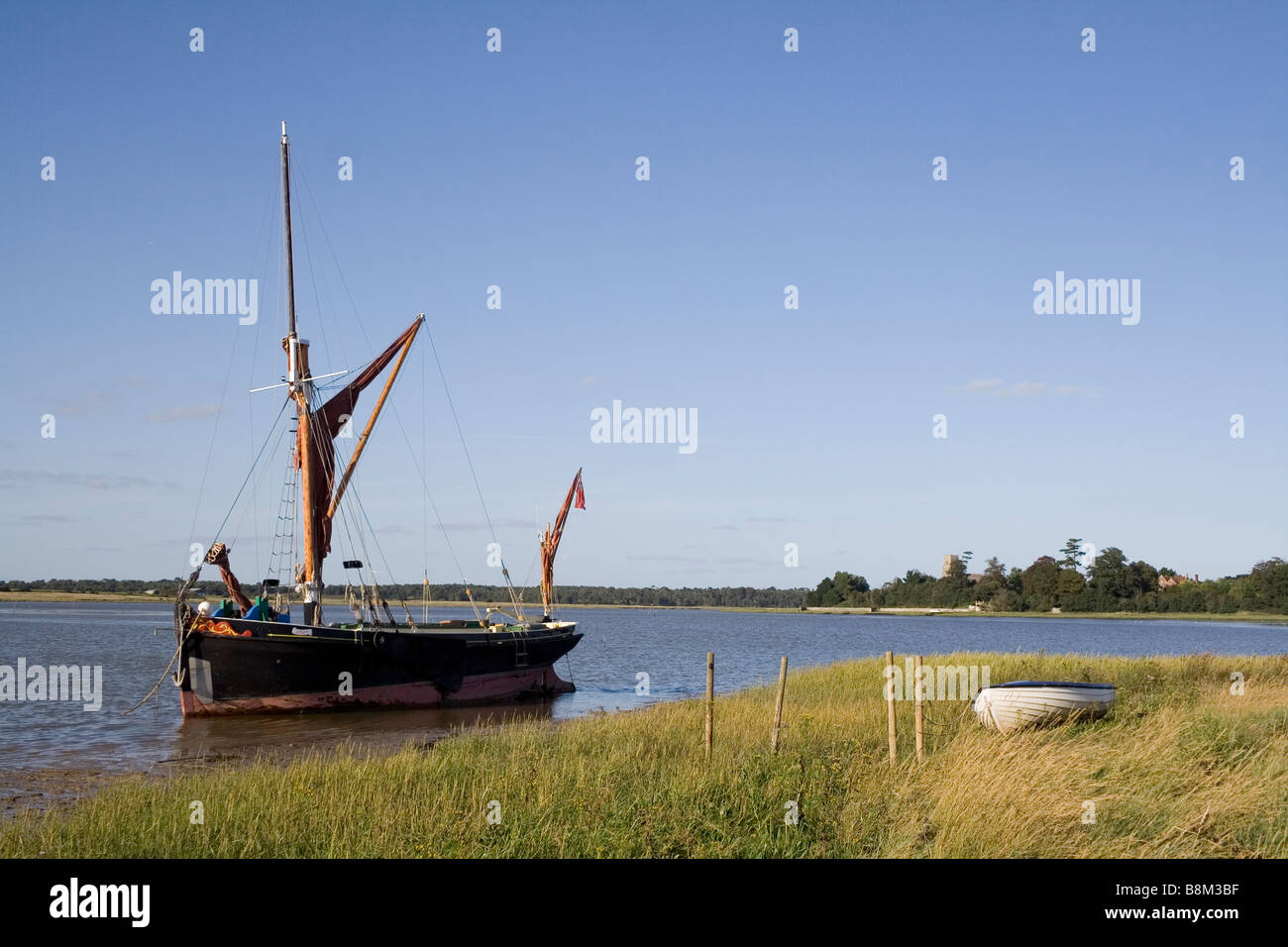 A Victorian spritsail sailing barge at anchor on the River Alde at Iken Reach Stock Photo