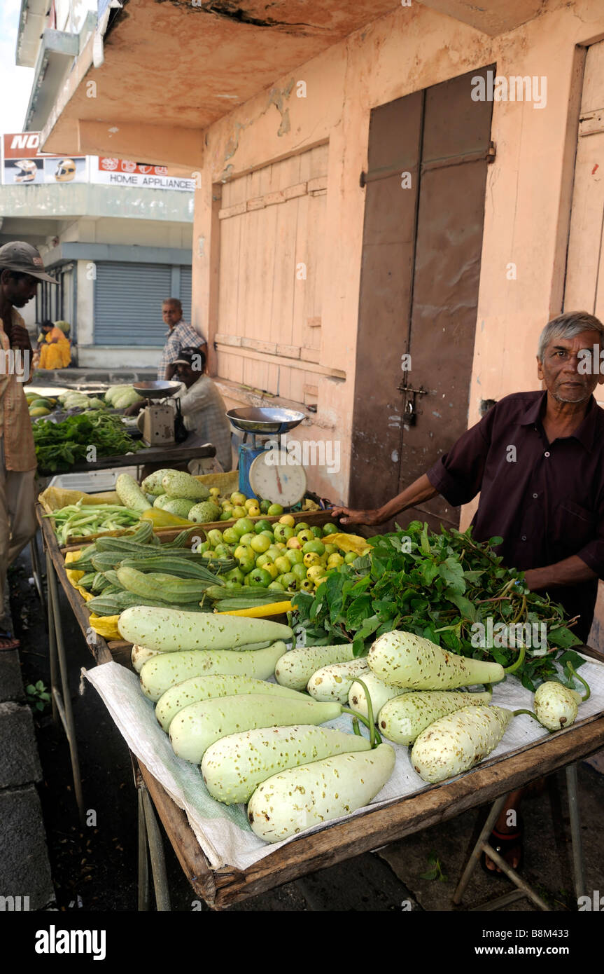 A Mauritian salesman at vegetable stand, Maheboug, Mauritius island