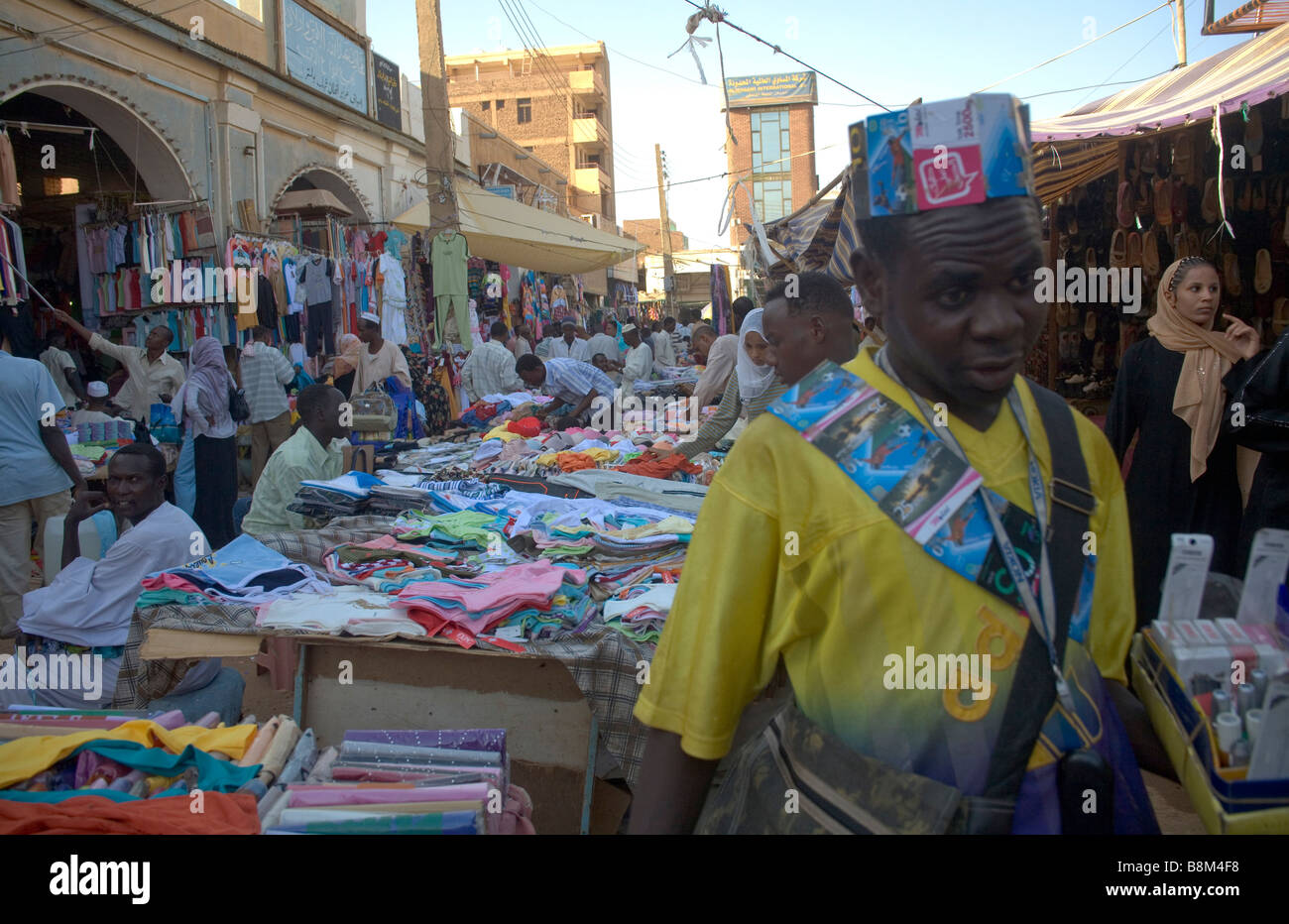 Telephone cards seller in the crowds of people in the streets at the market in Ommdurman, West Khartoum, Sudan Stock Photo