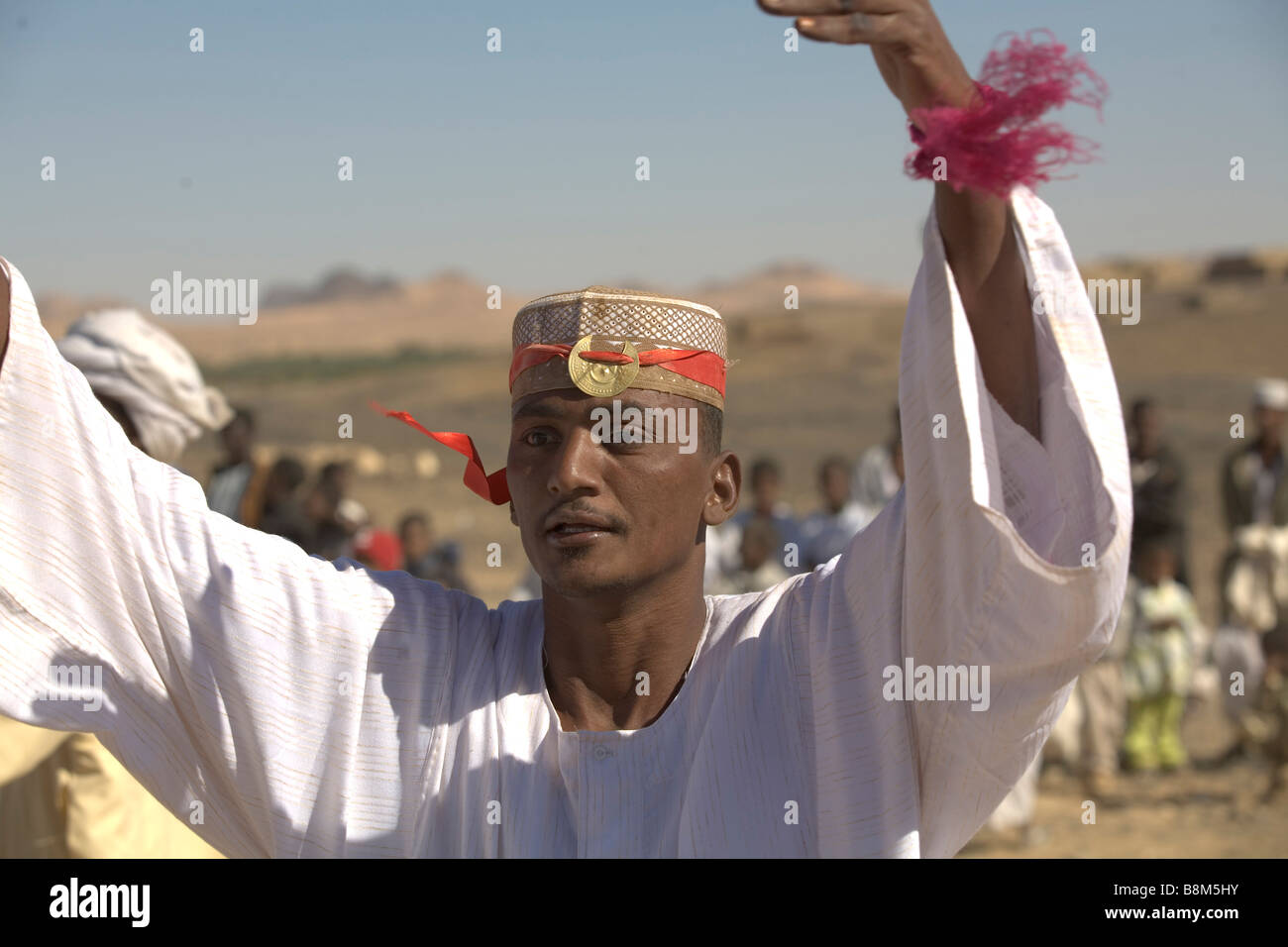 The groom is dancing during muslim marriage ceremony in El Ar village at 4th Nile River catharact region of Nubia in Sudan Stock Photo