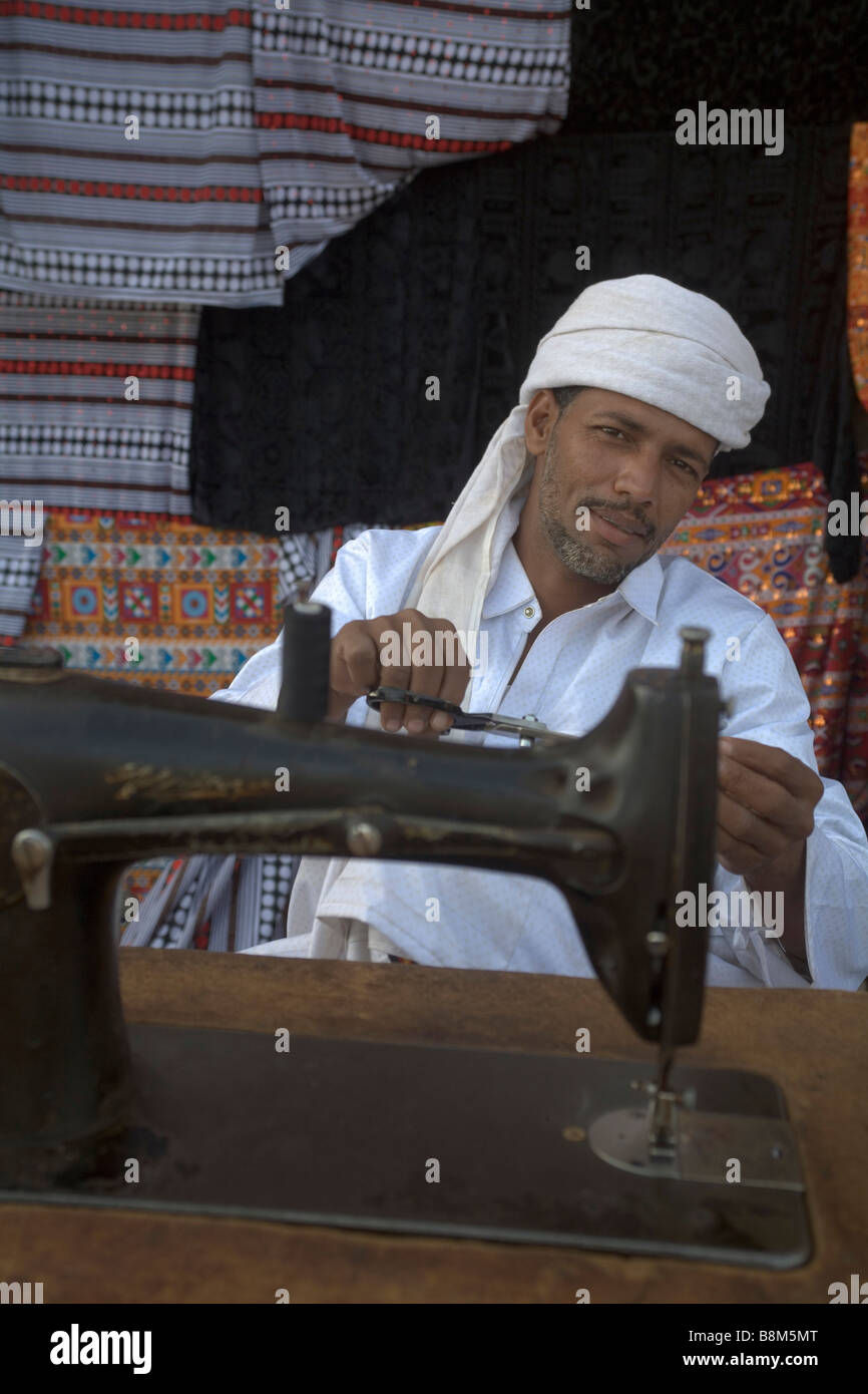 Rashaida man working with sewing machine at the market in Kassala at Erythrean border, East Sudan Stock Photo
