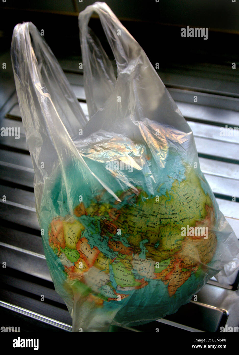 Plastic / Shopping / Carrier bag with world globe inside. Stock Photo