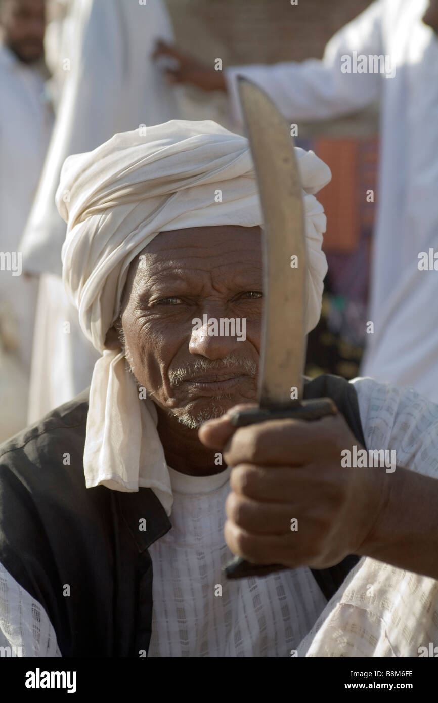 Rashaida men posing with his traditional knife at the market in Kassala at Erythrean border in Sudan Stock Photo