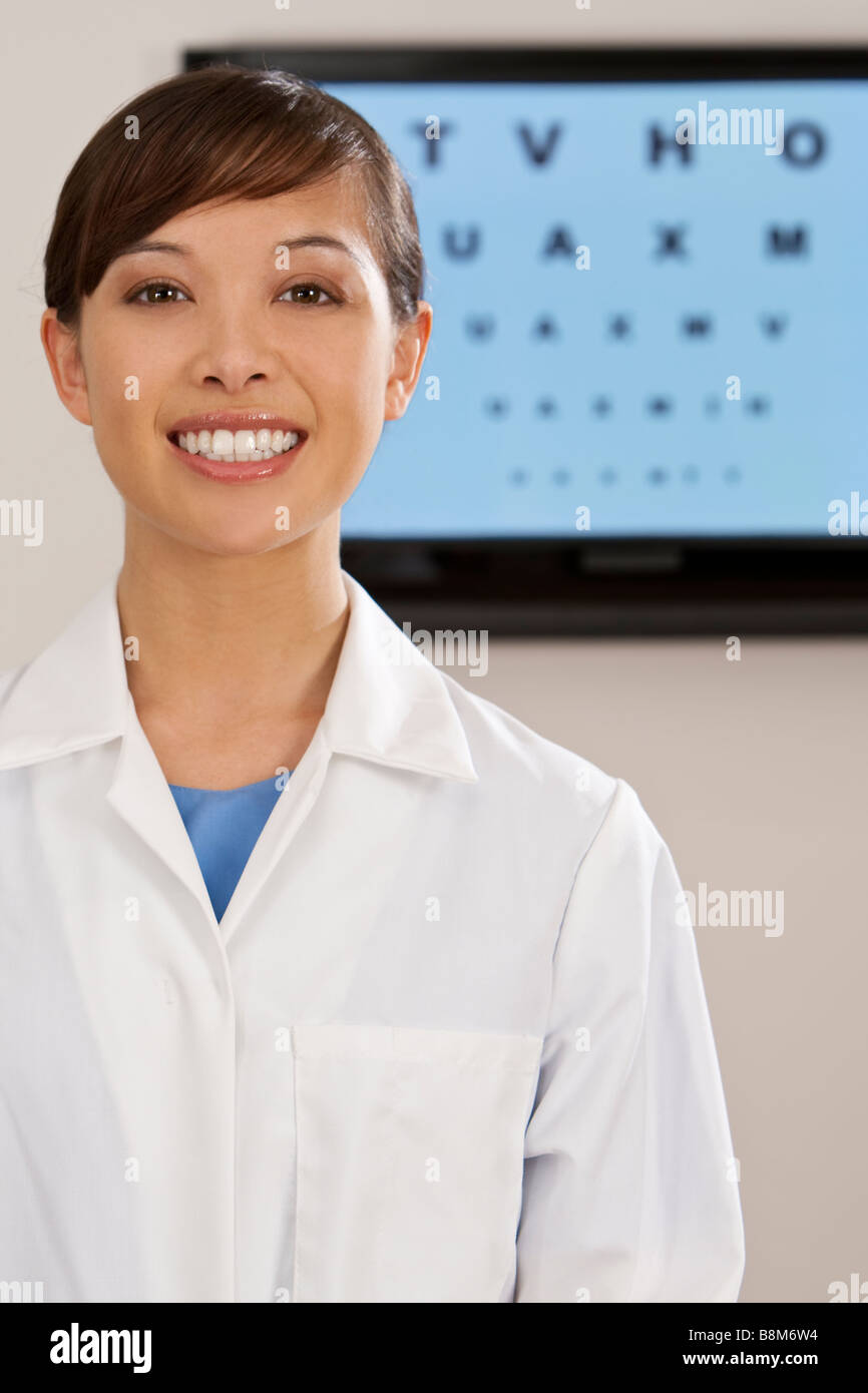 A beautiful female Asian optician shot with an electronic eye test