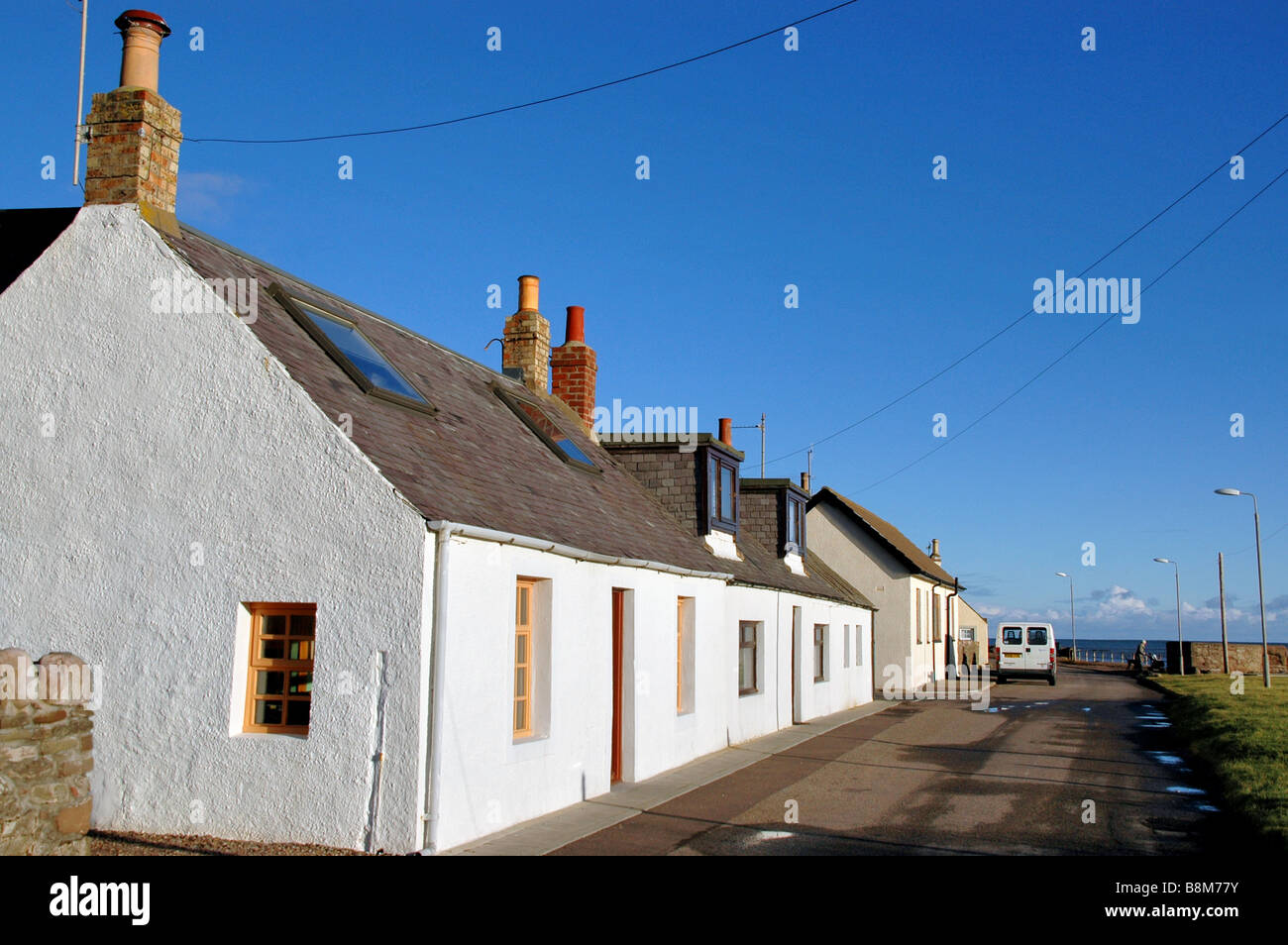 The original whitewashed fishermen's cottages  at Johnshaven, Grampian. Scotland. Stock Photo