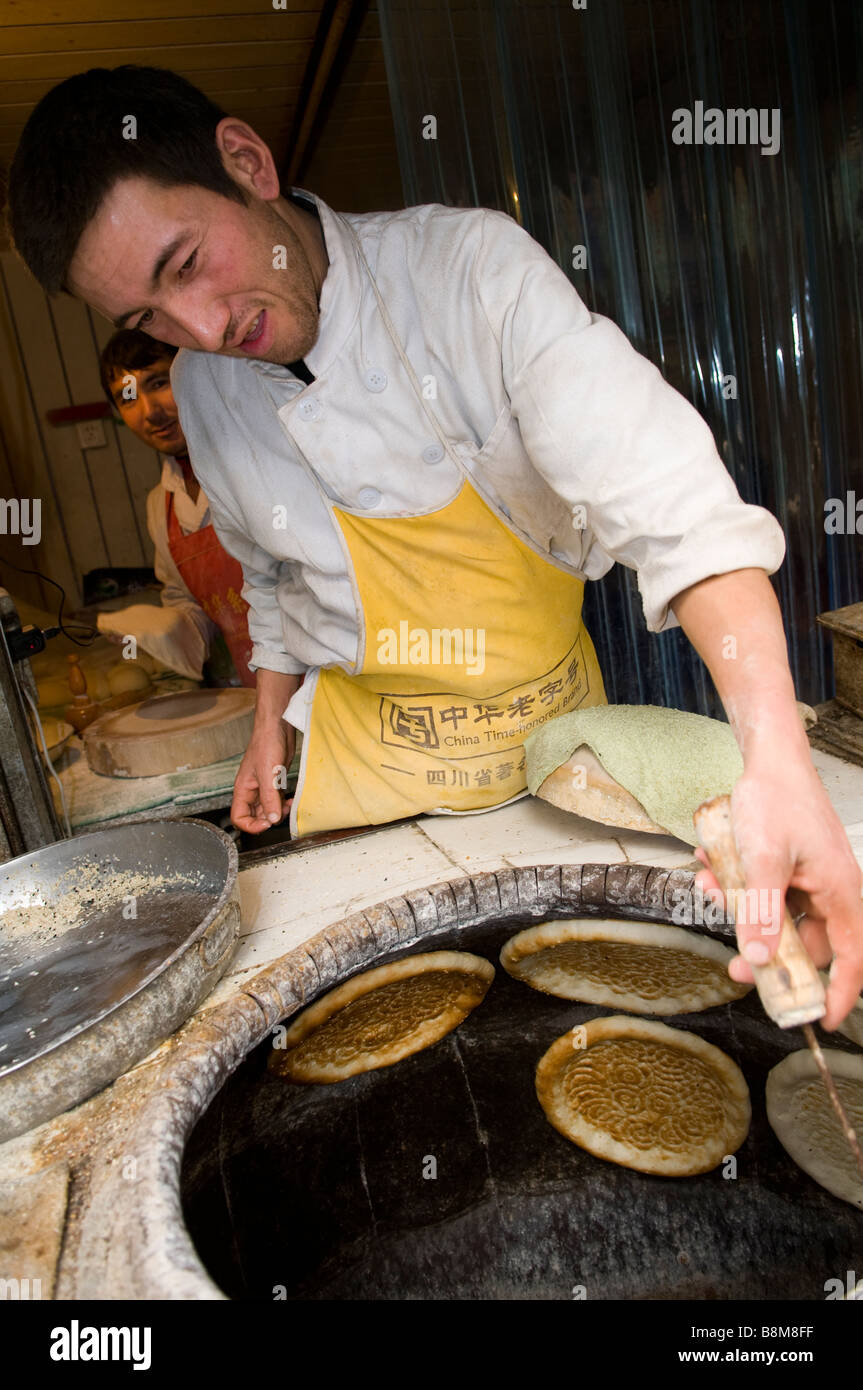 Fresh Nan / Naan bread is baked in the Tandoor clay oven in Xinjiang, China  Stock Photo - Alamy