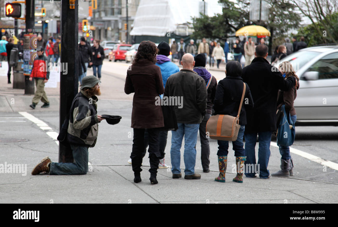 A man begs for spare change Stock Photo - Alamy