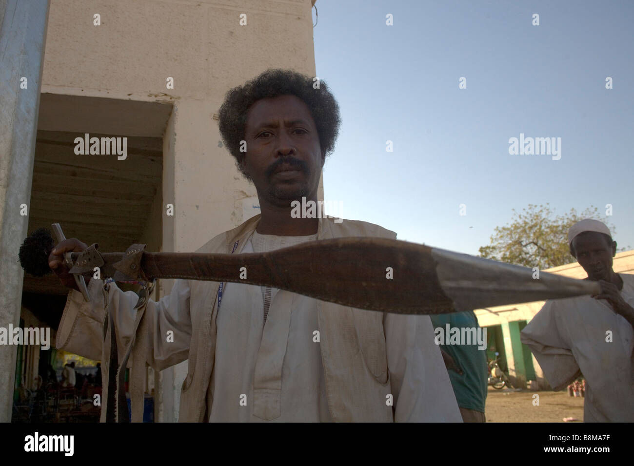 Beja man presenting his traditional sword in Kassala at Erythrean border in Sudan Stock Photo