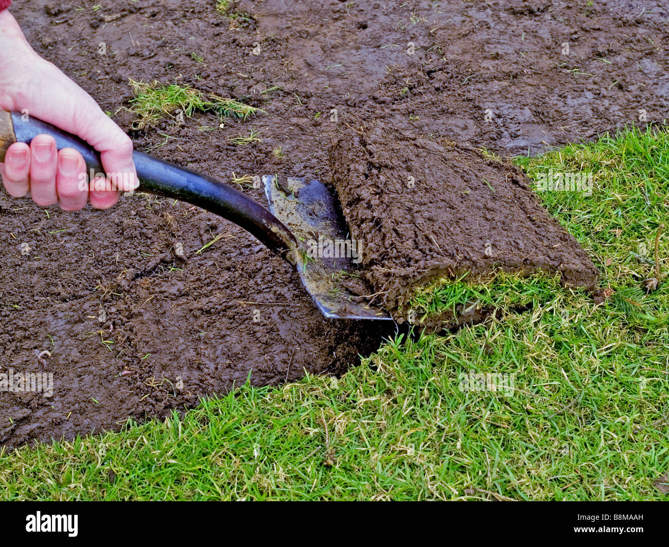 cutting up turf Stock Photo