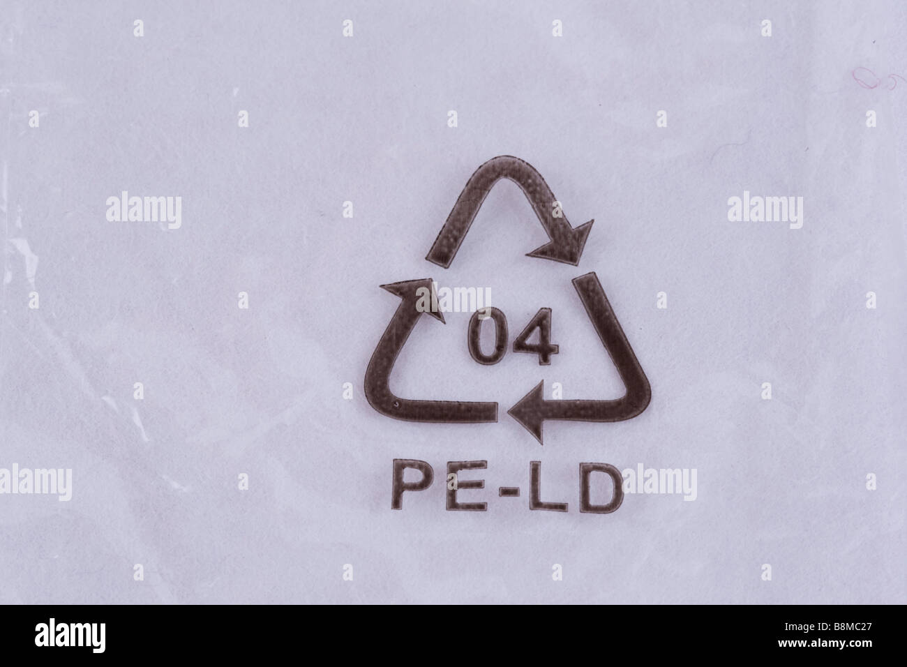 LDPE PE LD number 4 low density polyethylene recycling logo on plastic packaging UK Stock Photo