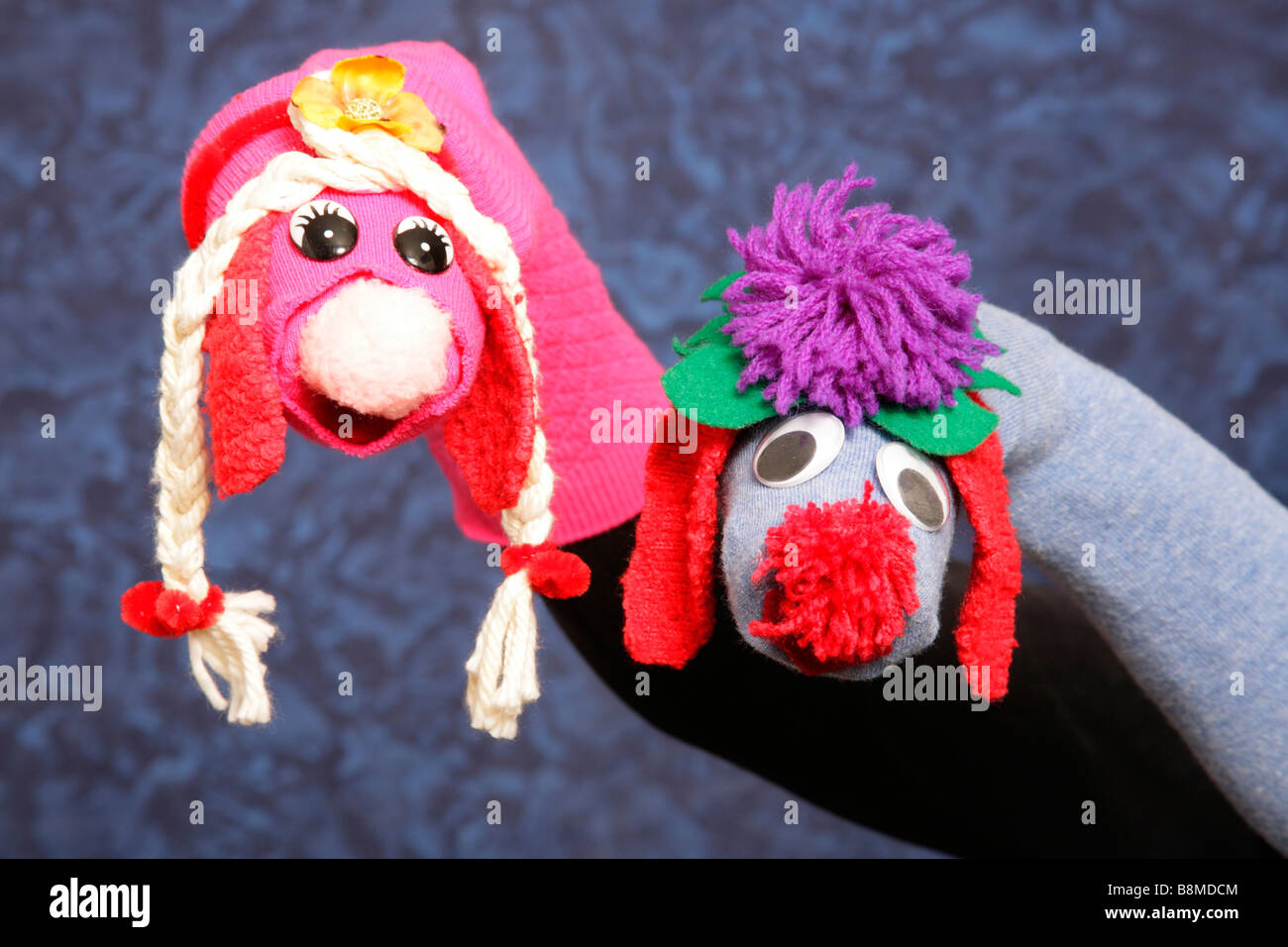 Hand manipulated pair of character puppets created from socks. Stock Photo